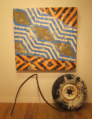 Duhirwe Rushemeza, Imigongo #1 (Blue, White, Taupe, Ochre, and Brown), 2013, thin-set mortar, concrete, acrylic house paint, wood and embedded metal detritus, 4 x 4 feet, 5 inches deep. Nomad Gallery. Photo: ARTEIDOLIA